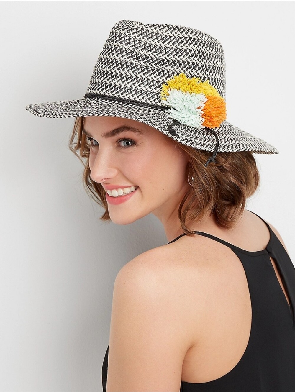 Black & White Straw Sun Hat with Yellow and Orange Pom Accent